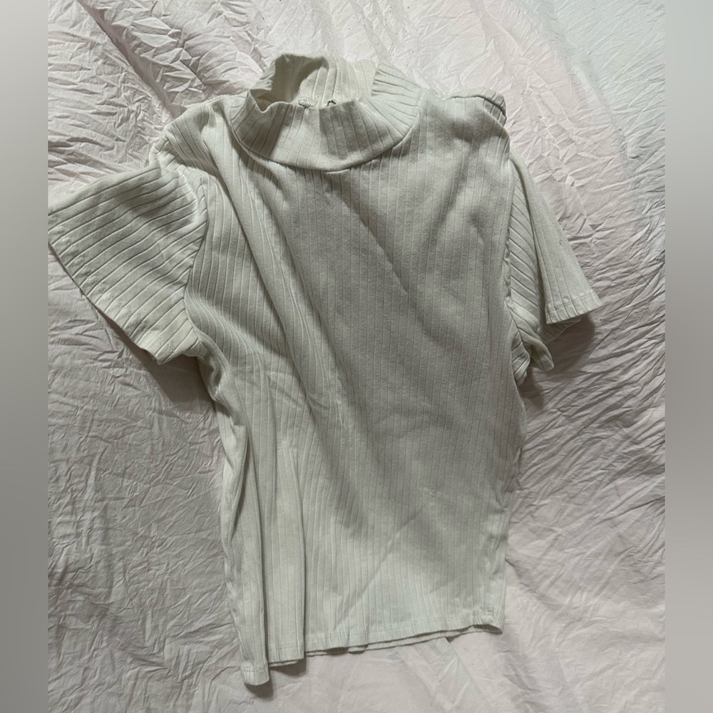 A white turtle neck lined shirt